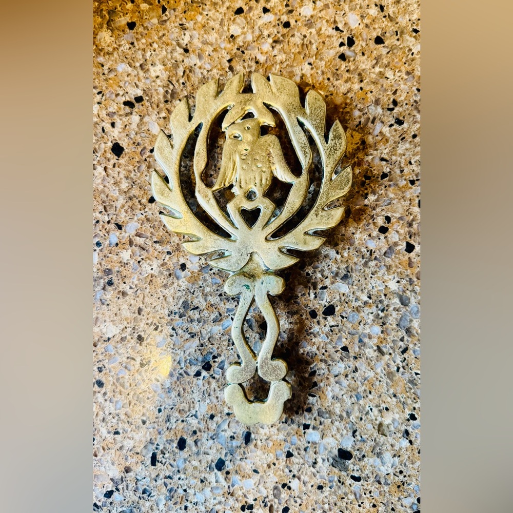 Brass trivet with eagle design
